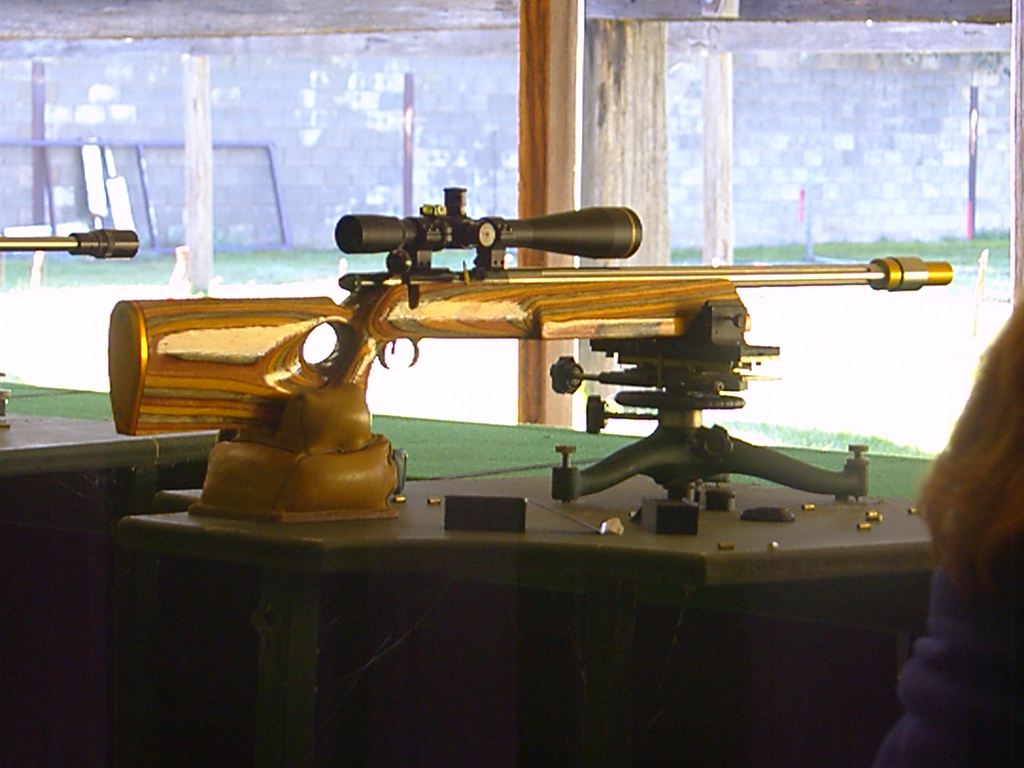 rifle sitting on a bench